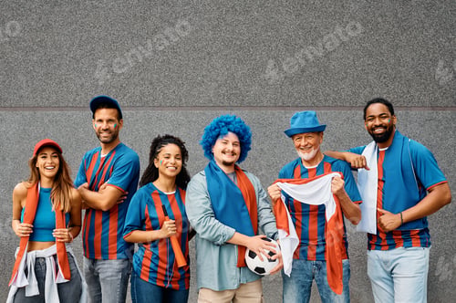 Preview: Group of happy mixed-age soccer fans during the world cup looking at camera.