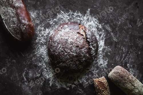 Preview: Different types of bread on black background