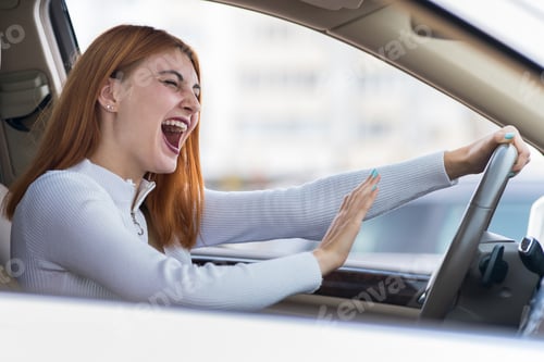 Preview: Closeup portrait of pissed off displeased angry aggressive woman driving a car