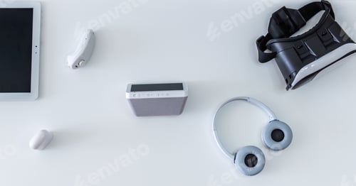 Preview: High angle shot of home tech entertainment equipment: tablets, headphones, virtual reality glasses
