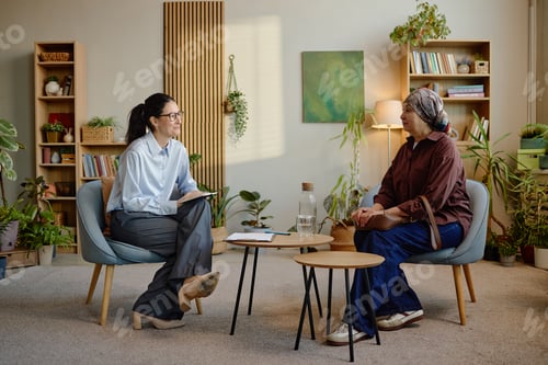 Preview: Middle Aged Caucasian Woman Consulting Female Psychologist during Therapy Session