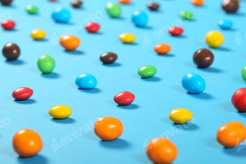 Preview: Dragee Candy Of Different Colors Lies On A Bright Background