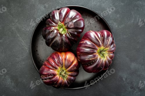 Preview: Three Heirloom Tomatoes on a Black Plate