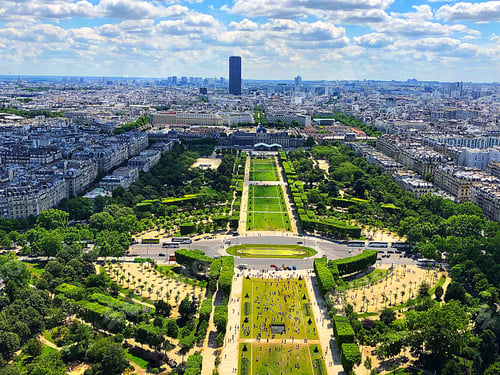 Preview: An aerial view of Champ de Mars from the top of the Eiffel Tower on a beautiful summer day in Paris!