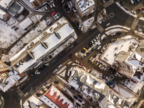 Preview: Aerial black and white winter top view of modern city with tall buildings