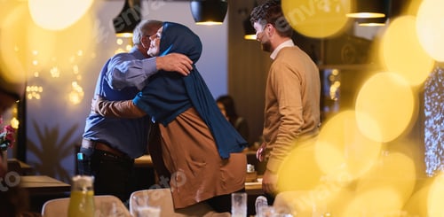 Preview: Grandparents arrive at their children's and grandchildren's gathering for iftar in a restaurant