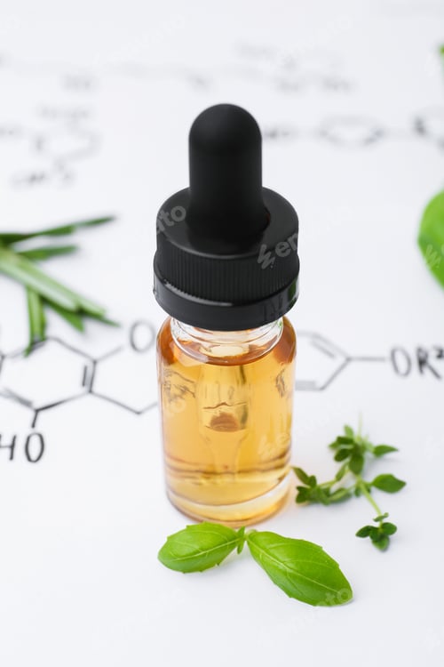 Preview: Different herbs and bottle of cosmetic product on paper with chemical formulas, closeup