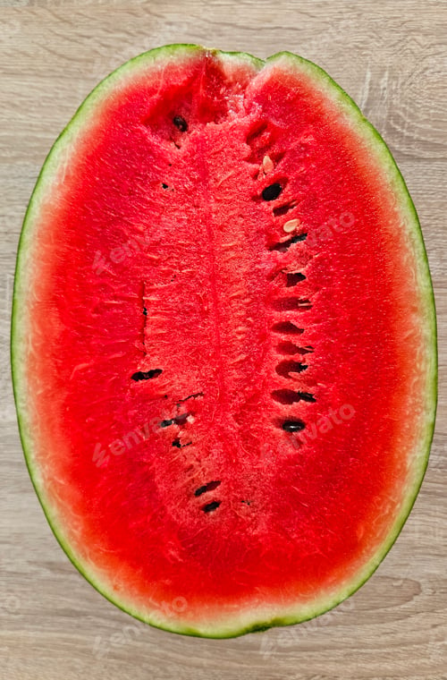 Preview: Close-up of cut ripe juicy red watermelon with seeds