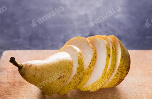 Preview: Healthy food, fruit background, sliced pear