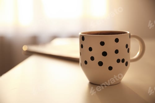 Preview: Cup of hot drink on table, space for text. Lazy morning