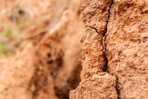 Preview: Detail and texture of the earth of a slope with cracks.