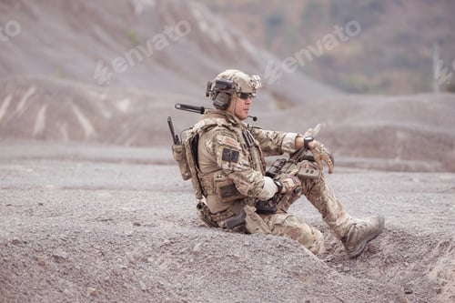 Preview: Soldiers in camouflage military uniforms carrying weapons Reconnaissance missions in rugged mountain