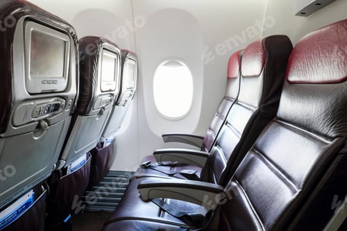 Preview: Inflight economy class cabin seats of an airplane.