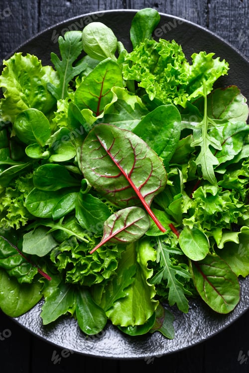 Preview: Fresh salad mix leaves in bowl shown in close up