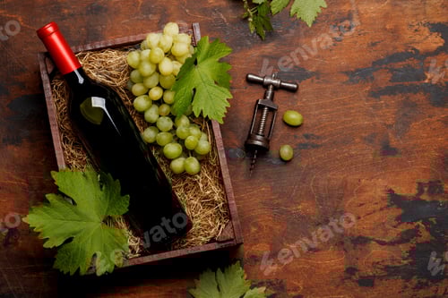 Preview: A red wine bottle and fresh grapes
