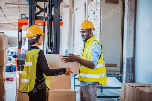 Preview: Industry workers helping to move produce boxes for folklife truck to keep on factory warehouse ,they