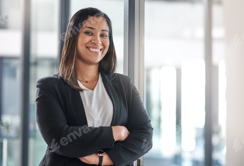 Preview: Portrait of a confident young businesswoman standing in an office