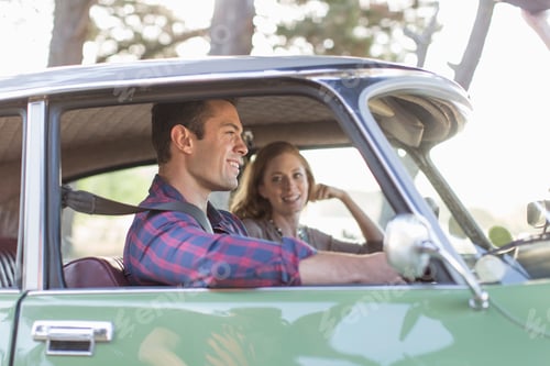 Preview: Heterosexual couple in car together, smiling