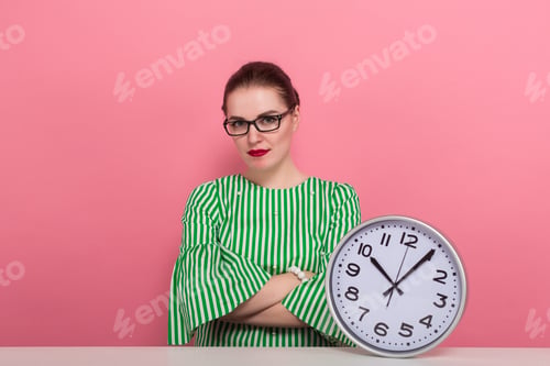 Preview: Businesswoman with hair bun and clocks