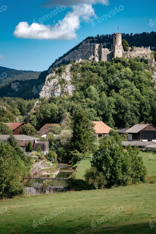 Preview: romantic castle on top of a hill in a mountainous valley