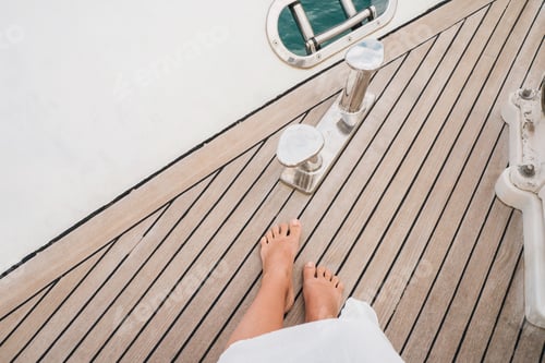 Preview: Woman standing on the deck of the yacht