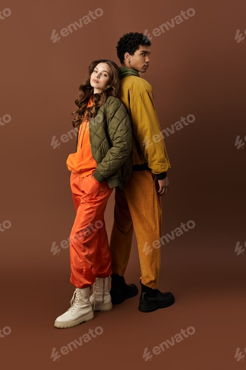 Preview: Vibrant autumn styles bring life to a young couple in a warm studio setting