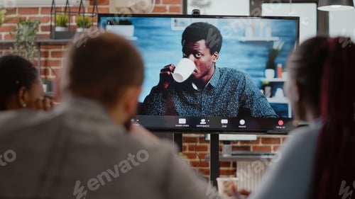 Preview: Close up of multi ethnic team talking on remote video call