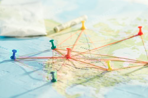 Preview: Selective focus of push pins and strings on world map