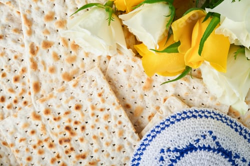 Preview: Passover celebration concept. Matzah, red kosher, white and yellow roses and walnut. Traditional rit