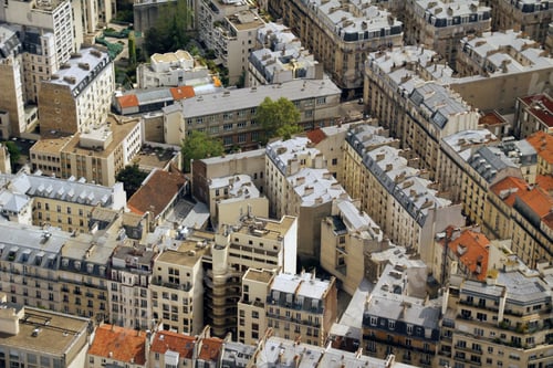 Preview: Aerial view of Parisian architecture with red and grey rooftops.