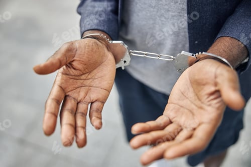Preview: Focused photo on male hands being in handcuffs