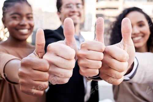 Preview: Shot of a diverse group of businesspeople standing together in the city and showing a thumbs up