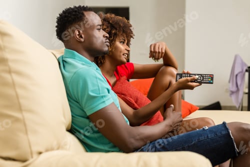 Preview: Couple Relaxing Together Watching Television at Home