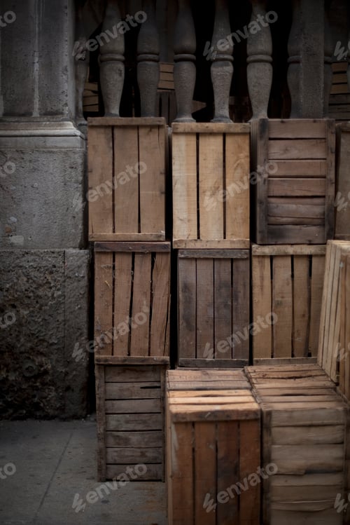 Preview: A stack of wooden crates, in the corner of a room.