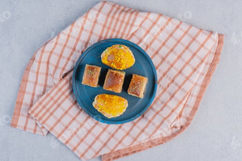 Preview: Baklava with pistachios and pastries dark plate