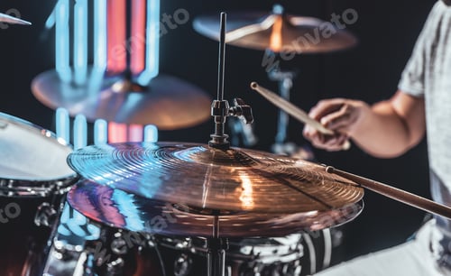 Preview: A male drummer plays drums with special drum sticks.