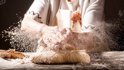 Preview: Photo of flour and women hands with flour splash. Cooking bread. Kneading the Dough