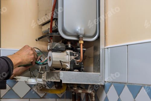 Preview: Water heater maintenance service technician repairing gas water heater