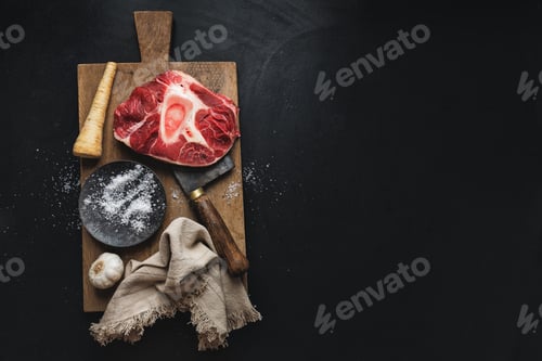 Preview: Raw meat with vegetables on dark