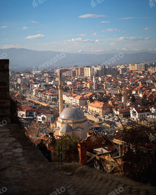 Preview: a city view with an aerial view of buildings and an old clock tower