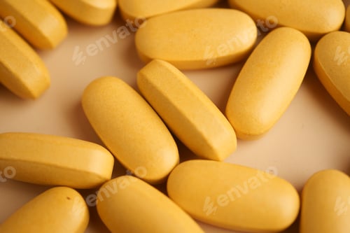 Preview: Yellow tablets arranged on a light background