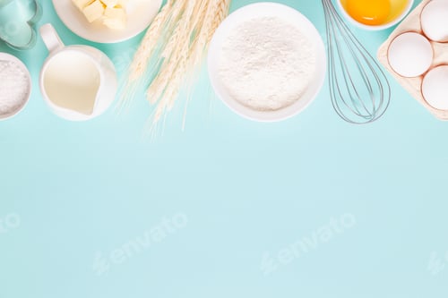 Preview: Ingredients for baking on light blue background.