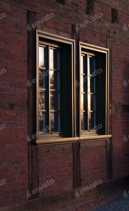 Vorschau: Der Blick auf ein Fenster in einem historischen Gebäude, roter Backstein, getrennt durch dunkles, in der Sonne versunkenes Holz.