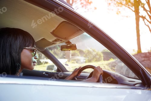 Preview: Young woman driving car