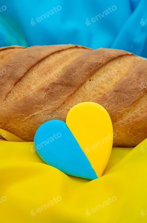 Preview: Bread on the Ukrainian flag. Selective focus.