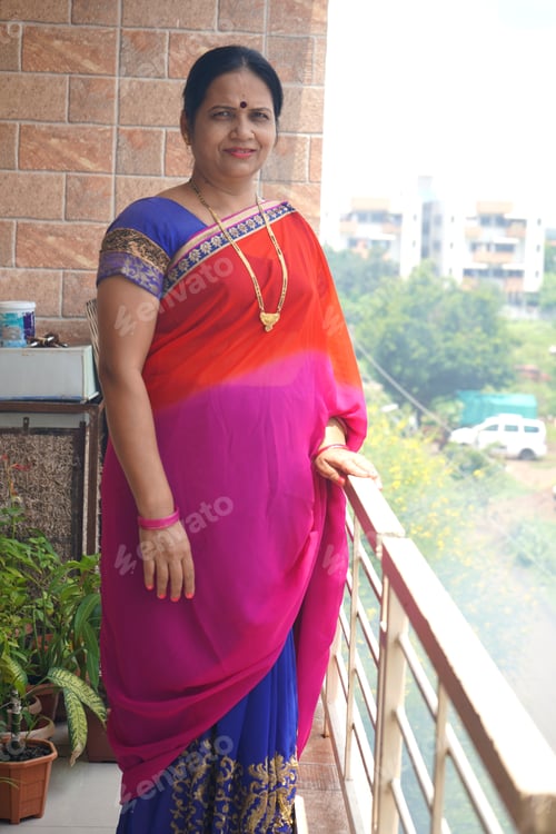 Preview: Portrait of happy Indian woman at her home