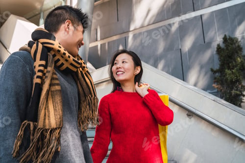 Preview: Asian couple shopping in the mall.