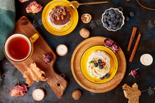 Preview: Fall with Pavlova cakes,Tea Cup. Autumn tea time vibes flat lay on rustic background.