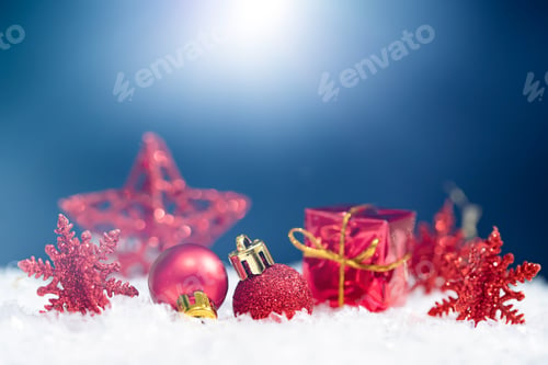 Preview: Red Christmas decoration on blue background in sparkling holiday lights.