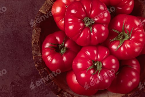 Preview: Pink tomatoes, in a rustic wooden bowl, close-up, no people,